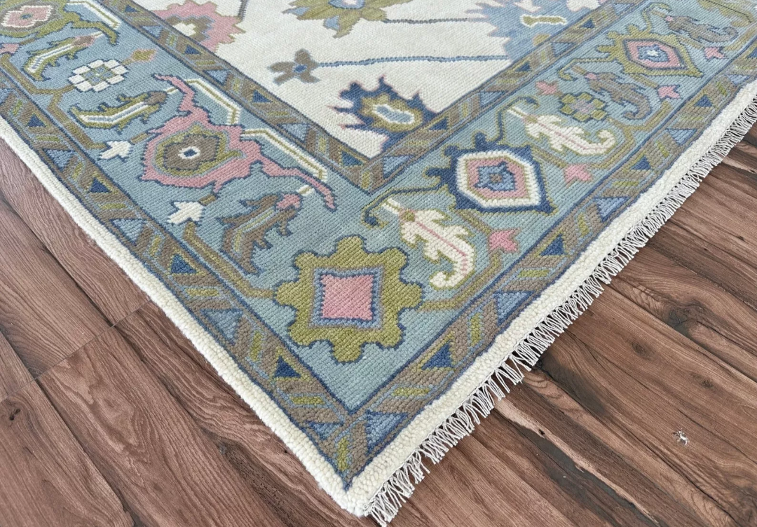 Hand Knotted Oushak Rug – Ivory Turkish Wool Area Rug with Soft Pastel Motifs