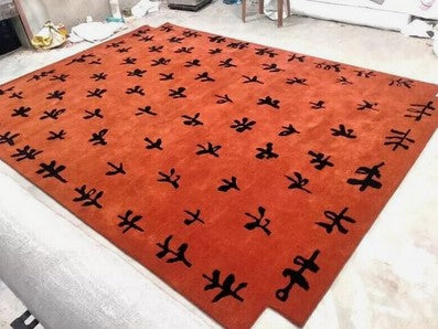 Hand Tufted Orange Wool Rug with Black Abstract Motifs | Modern Artisan Area Carpet